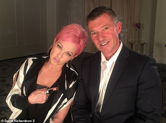 Former Today Tonight reporter David Richardson (pictured with Cyndi Lauper) has only recently moved to the Northern Territory capital to take up the leadership position