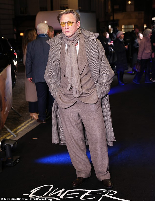 Daniel Craig cut a dapper figure in a gray wool suit as he posed on the star-studded red carpet at his Queer film premiere at The Curzon in Mayfair, London, on Tuesday