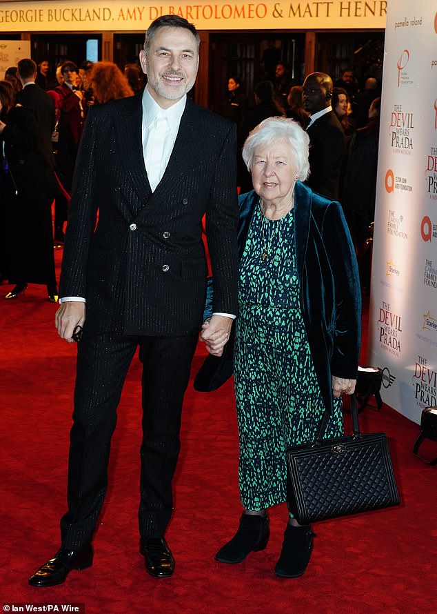 He was pictured beaming holding the hand of his beloved mother Kathleen as he led her down the red carpet to the chic event, which was packed with famous faces.