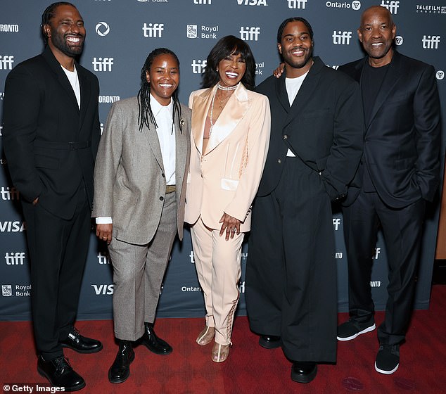 Denzel (right) posed with his wife Pauletta (center) and three of their children, (from left) John David, Katia and Malcolm at the Toronto International Film Festival in September