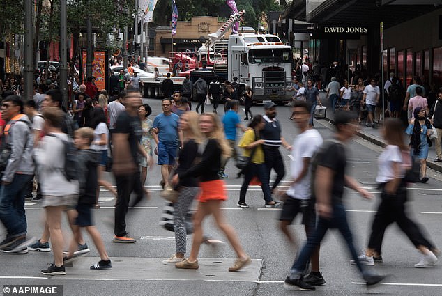 Immigration levels in Australia have risen to record highs of over 500,000 amid a rental and housing price crisis (pictured are pedestrians in Sydney)