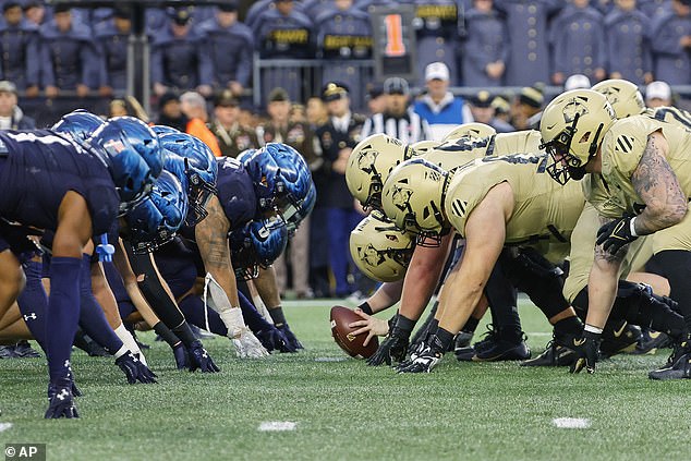 The Navy Midshipmen and the Army Black Knights line up for the scrimmage during the first quarter of their 2023 meet, which Army won 17-11.