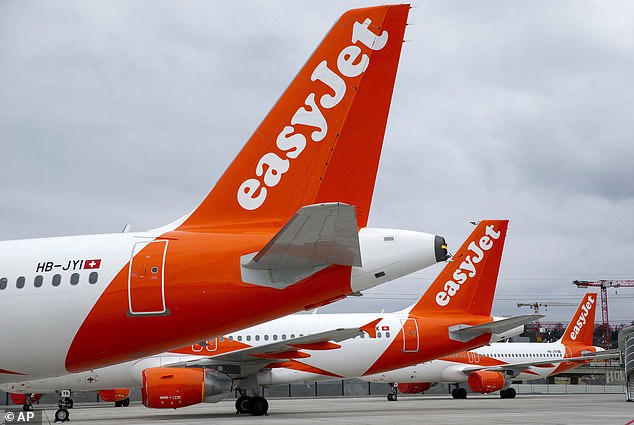 Fly away: EasyJet's total pre-tax profits rose by more than a third to £610 million in the 12 months ended September 30