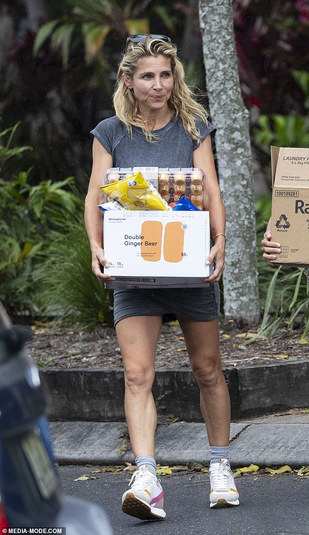 Elsa Pataky cut a stylish figure as she was spotted running errands before her husband Chris Hemsworth's return to Byron Bay on Wednesday