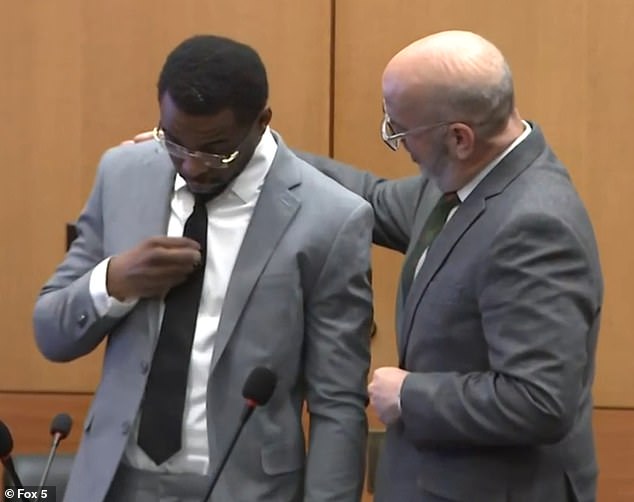 Deamonte Kendrick, also known as Yak Gotti, was acquitted Tuesday of murder, racketeering and gang-related charges in a sweeping trial that saw Young Thug freed in October. Kendrick, who wore a Prada tie in court, appeared relieved and made the sign of the cross (pictured) after being told he was not guilty