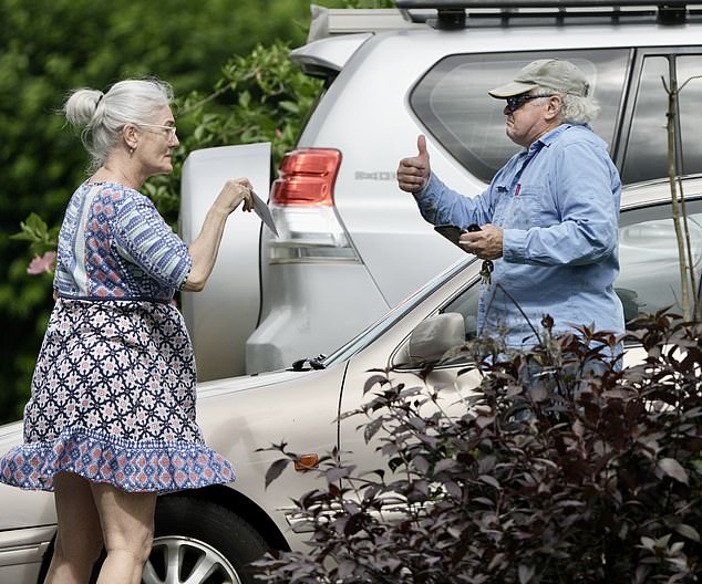 Lee Rush, the father of released Bali Nine member Scott Rush, gave a thumbs up while speaking to a woman outside his Brisbane home on Monday