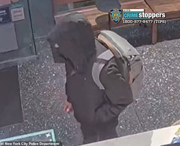 The suspected shooter, complete with backpack, is seen in a Starbucks, on Sixth Avenue, before the shooting