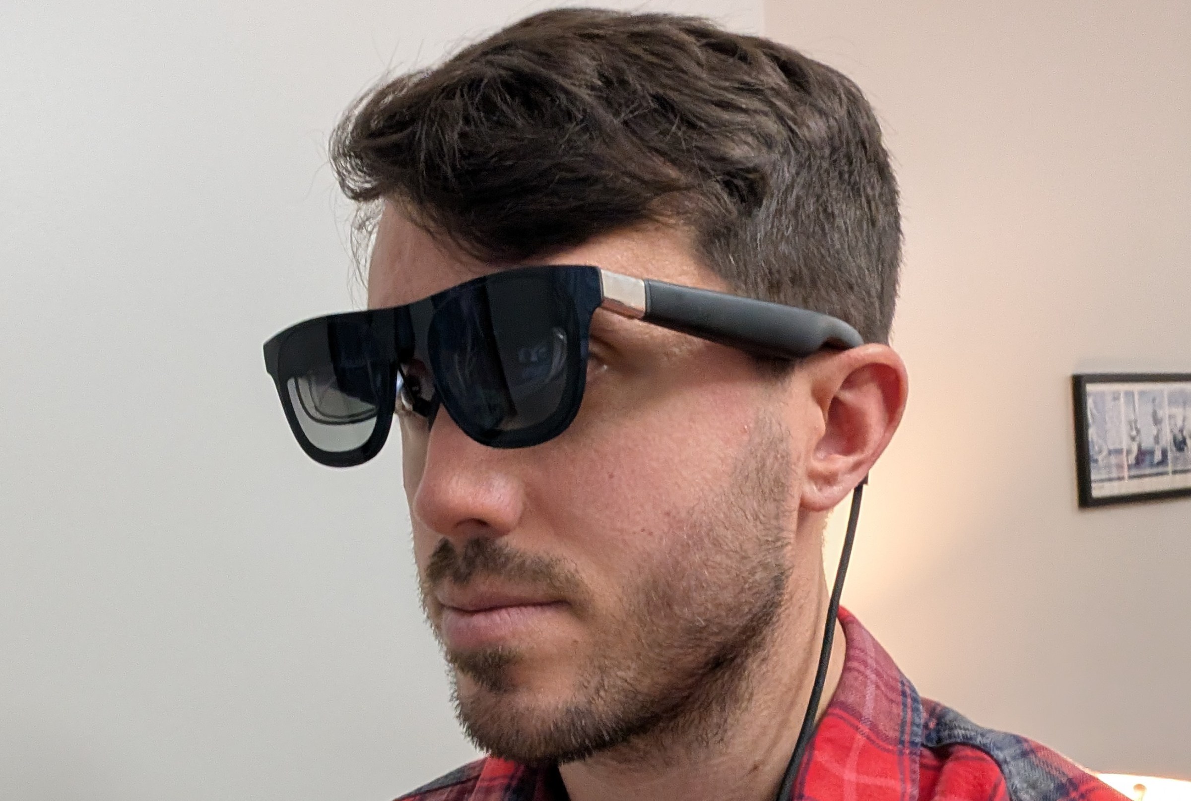 Polygon's Cameron Faulkner wears the Xreal One AR glasses.