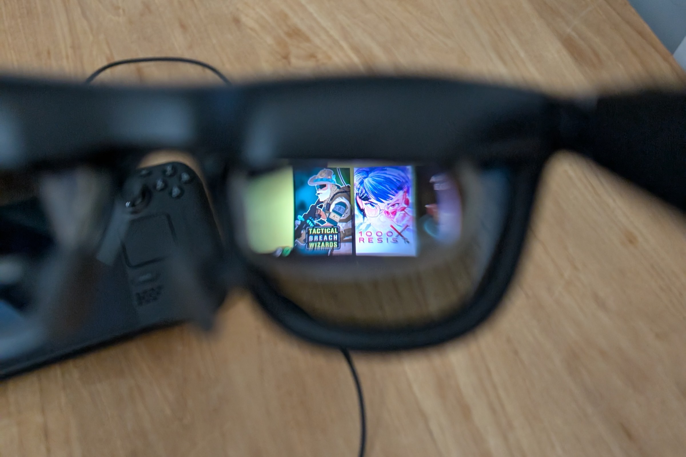 An image of the small micro-OLED screens in the Xreal One AR glasses. The screen shows the SteamOS home interface, with game tiles from 1000X Resist, Tactical Breach Wizards and Cyberpunk 2077