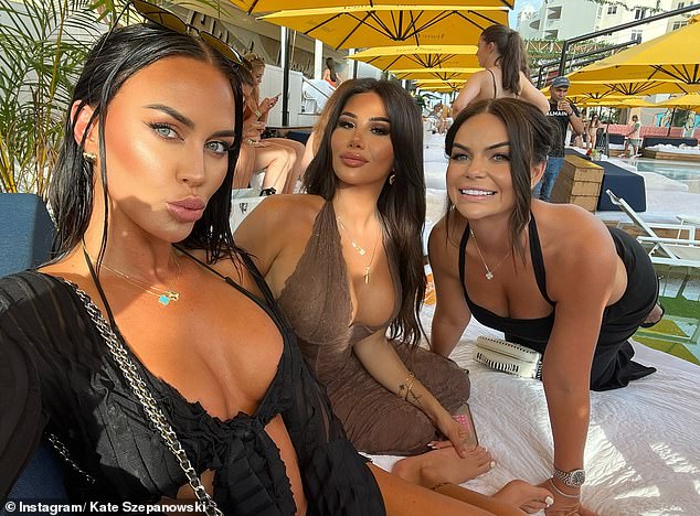 The Instagram star unveiled her stunning new look as she flaunted her toned figure in a black crop top and matching colored shorts while partying with friends