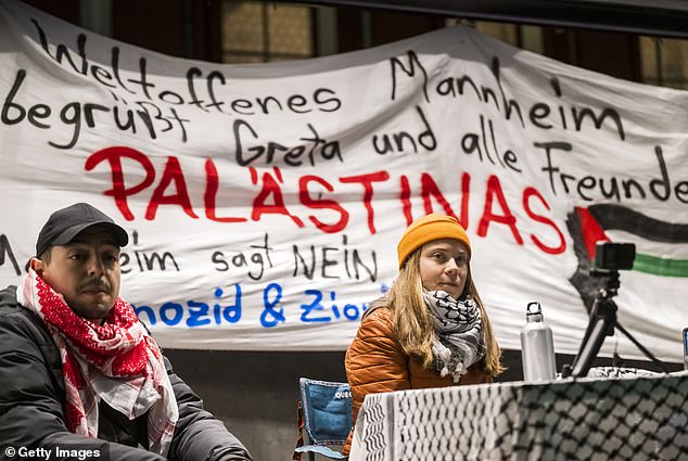 Greta Thunberg and German activist Hassan Ã-zbay (L) speak during a solidarity event with Palestine in Mannheim, Germany