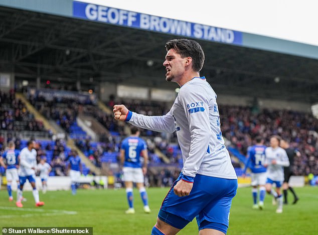 Hagi celebrates with the traveling Rangers fans after his assist led to the winner on Sunday