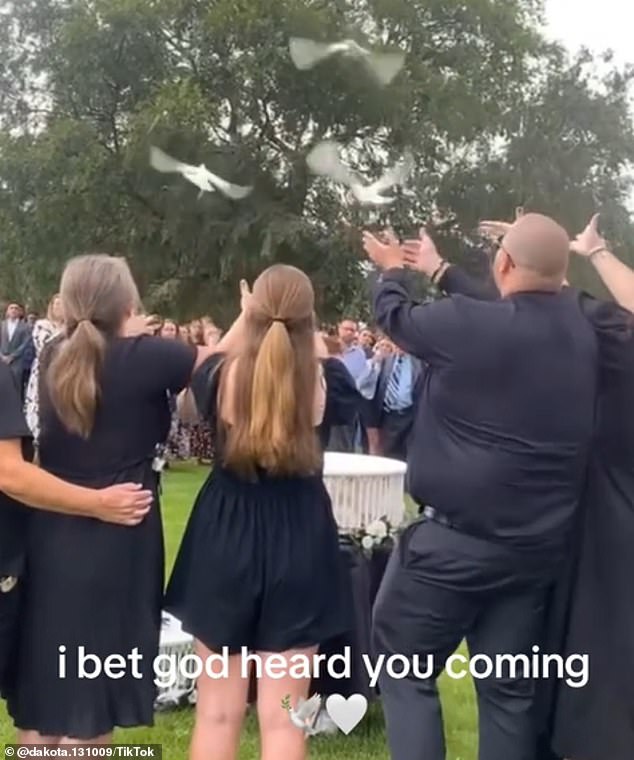 Isaac Walton's parents and siblings released white doves during the ceremony