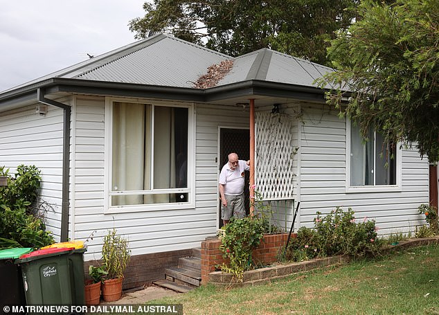 The grieving father says he complained about his neighbor's gum tree for years before his son was reportedly killed in a row over fallen branches. John Franks is pictured at the Mount Pritchard home in Sydney's western suburbs where he lived with son Michael Wickham