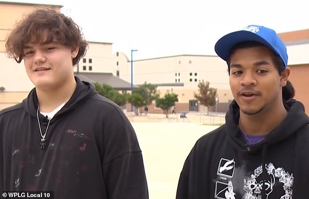 Fellow students Aidan Anthony-Gonzalez (left) and Steven Amaro (right) instead ran to retrieve the automated external defibrillator (AED) from where it was stored and began preparing it for use on Compton