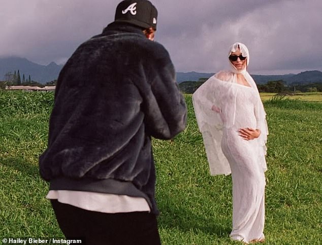 The photo they shared the news with showed Michelle in a striking white outfit, which drew comparisons to the photo Justin and Hailey Bieber posted to announce they were expecting their first child in May.