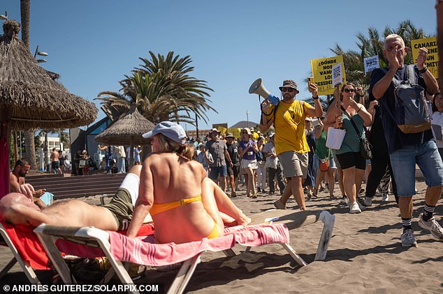 This couple was enjoying a day out at the beach when rowdy protesters took over