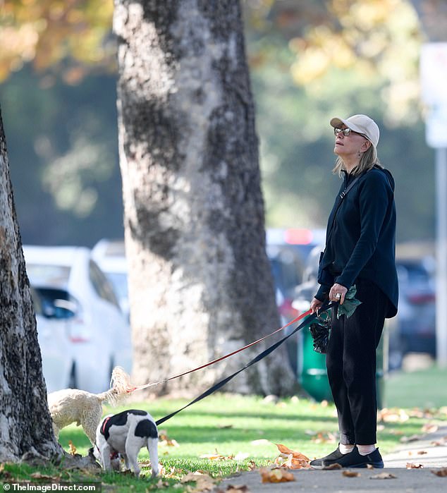 She was unrecognizable compared to her heyday thanks to her minimal makeup and shoulder-length blonde hair, which contrasted with the voluminous brunette locks she wore decades ago