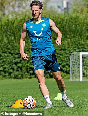 Tom Lockyer has returned to training with Luton for eight months after suffering cardiac arrest during a Premier League match