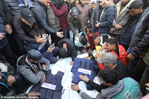 Relatives of photojournalists who lost their lives after Israeli forces struck the live broadcast vehicle of Al-Quds al-Youm Television (alqudstoday-tv) in Nuseirat refugee camp mourn as they hold a funeral ceremony for them at Al Awda Hospital in Gaza city, Gaza on December 26, 2024