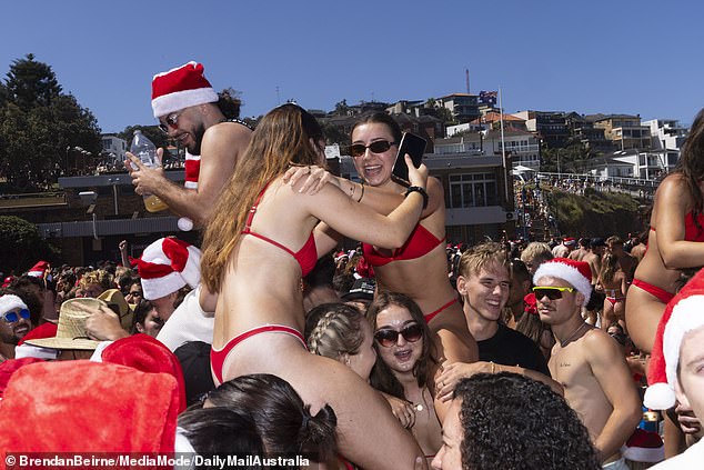 Partygoers were seen wrestling with each other while riding on the shoulders of their friends