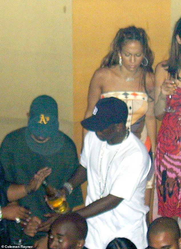 The photos were taken at the now defunct Lotus nightclub in New York on September 7, 2000. J Lo stands with her sister Lynda and glares at Diddy after their apparent argument.