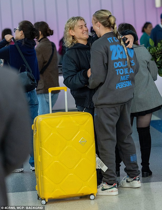 The two strange women hugged each other tightly during their reunion