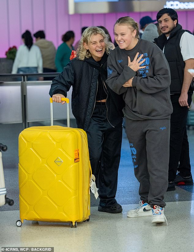 The dancer and social media sensation, 21, jumped for joy as Kath emerged from their flight from Australia