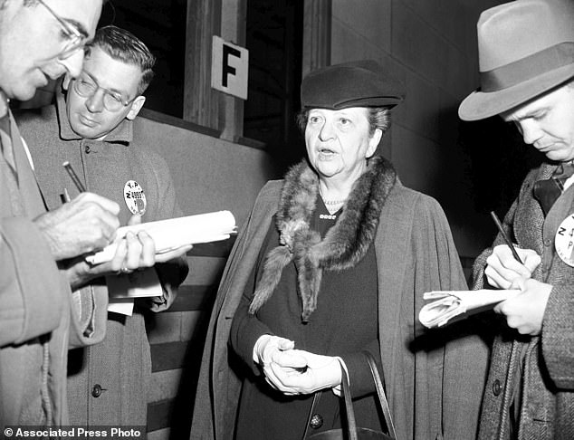 Secretary of Labor Frances Perkins talks to reporters in November 1945