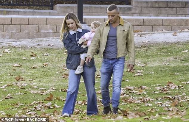 Joey Lawrence and new wife Samantha Cope looked loved up as they enjoyed a family time in the park in LA on Tuesday - after calling off their divorce