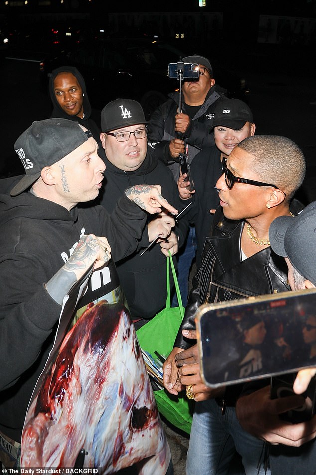 Pharrell tried to hug an animal rights activist who confronted him outside the Chateau Marmont after the GQ Men of the Year Awards in November.