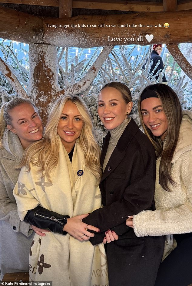 Kate Ferdinand (second from right) got into the Christmas spirit on Thursday as she enjoyed a snowy trip to Lapland, UK, with her children and friends