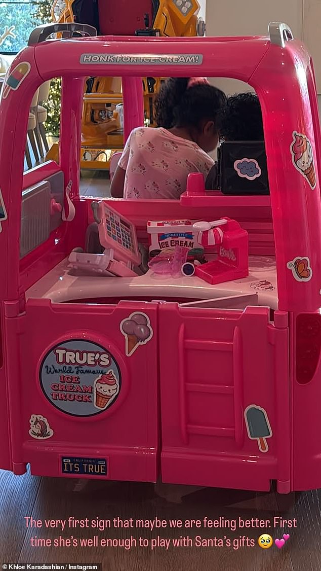 Chicago's cousin True Thompson, six, was declared cured after a 105-degree fever left her in bed over the holidays. True's mother, Khloe Kardashian, posted this photo of the patient playing with a Santa toy ice cream truck