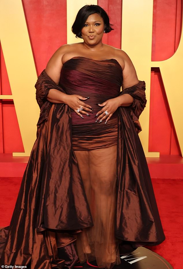 Lizzo, 36, won a legal victory when a harassment and discrimination lawsuit was dismissed by a California court on Monday; seen in March in Beverly Hills