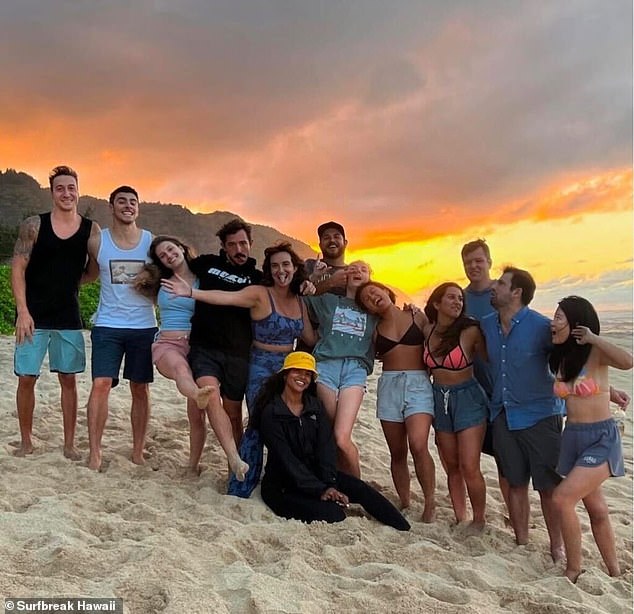 Mangione is pictured second from left with a group of friends during a stay in Hawaii