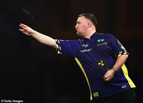 LONDON, ENGLAND – DECEMBER 21: Luke Littler of England throws against Ryan Meikle of England during their round two match on day seven of the 2024/25 Paddy Power World Darts Championship at Alexandra Palace on December 21, 2024 in London, England. (Photo by James Fearn/Getty Images)