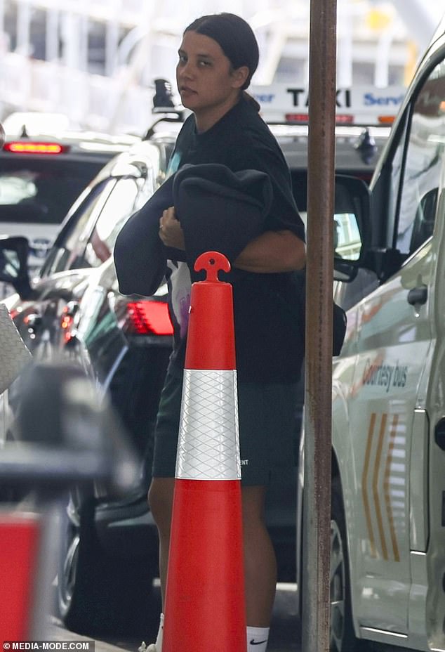 A somber-looking Sam Kerr at Sydney airport on Saturday after hearing the news about her grandmother