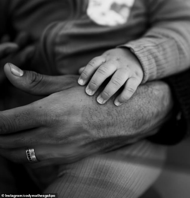 Gakpo shared a photo of his hand next to that of his son Samuel Seth, born in 2024