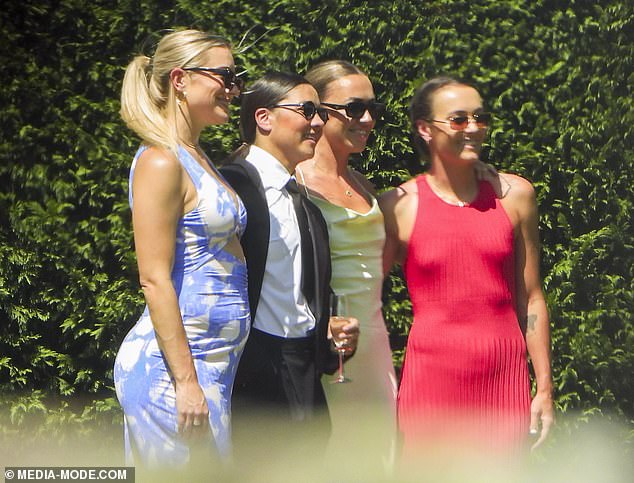 Several of Van Egmond's teammates were in attendance, including Sam Kerr (second from left) who posed for photos with her partner Kristie Mewis (left). Arsenal star Katie McCabe (second from right) and Caitlin Foord (right) had their photo taken with the couple