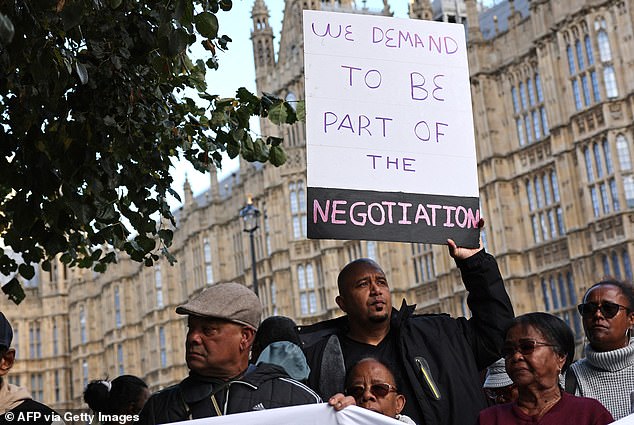 Protesters express their opposition to the deal outside parliament. Downing Street has refused to reveal how much it has offered to pay Mauritius for a 99-year lease on the crucial Anglo-American military base at Diego Garcia, the largest of the Chagos atolls.