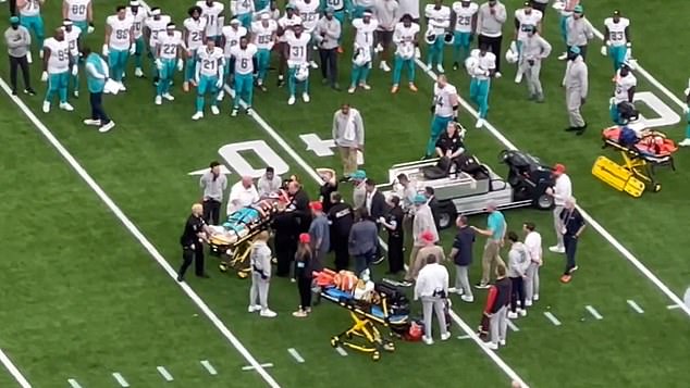 Medics cut off Grant Duboses jersey and cart him off