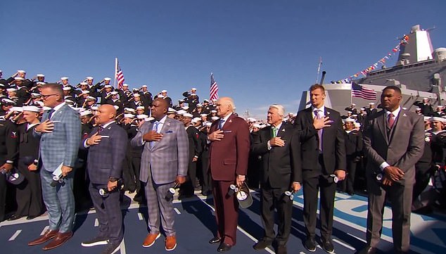 Strahan (right) was criticized in November for not placing his hand over his heart during the national anthem on Sunday, the day before Veterans Day