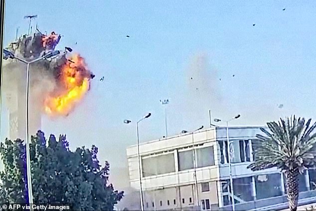 The video then cuts to show the moment the Israeli attack hits the control tower, sending debris and smoke billowing into the air