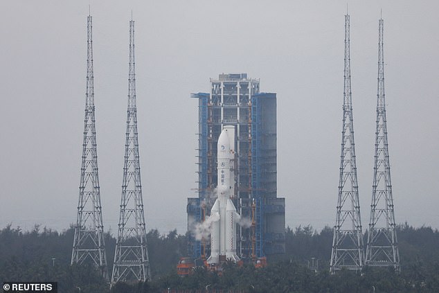 The Chang'e 6 moon probe and the Long March-5 Y8 launch vehicle combination sit atop the launch pad at the Wenchang Space Launch Site in Hainan Province on May 3, 2024