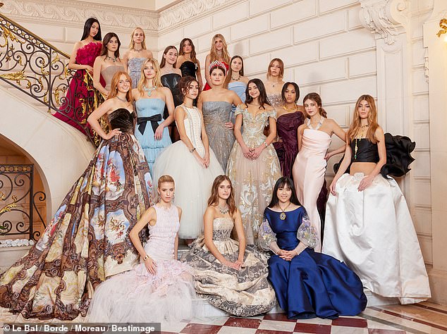 Gwyneth Paltrow and Chris Martin's daughter Apple Martin made her debut into society at a grand debutante ball in Paris on Saturday - but a mysterious redhead is now stealing her thunder