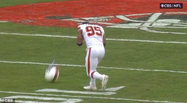 Garrett quickly ripped off his helmet even though the game continued on the field in Cleveland