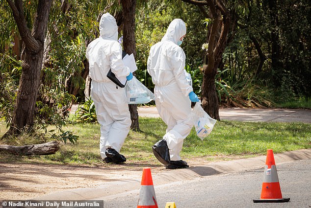 Forensic teams were seen carrying bags of evidence out of the home