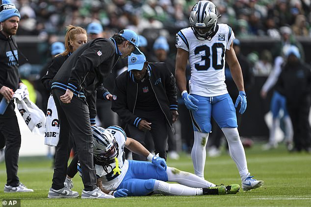 Panthers star Jonathon Brooks (below) tore his ACL during Sunday's loss to the Eagles