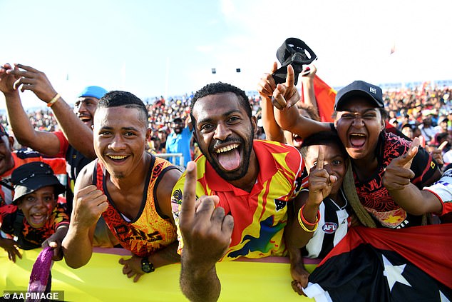 Rugby league is the national sport of Papua New Guinea (pictured, fans watch the Kumuls in action in Port Moresby) - an NRL team expected to be operational in 2028