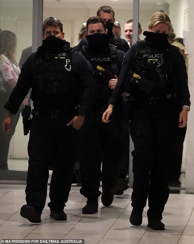 Dramatic footage taken shortly after 8pm shows around 20 detectives and balaclava-clad riot police descending on a block of flats on Baker Street - less than 100 meters from the Legal Aid offices, which are still being forensically examined.